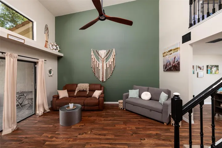 living room with sliding glass doors to screened in porch