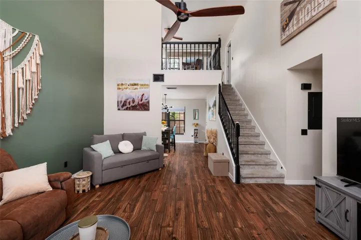 living room with stairs to second floor