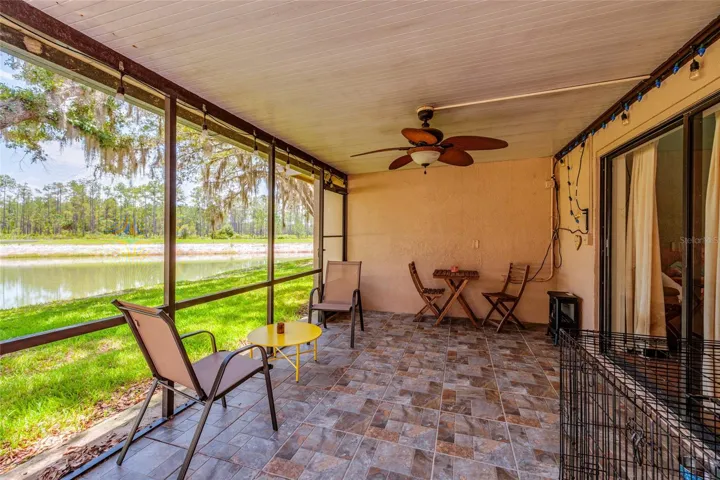 screened in porch with lake view