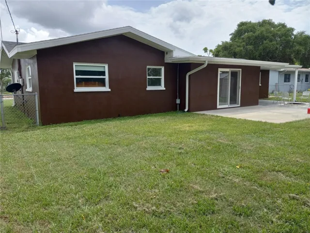 large, fully fenced, flat back yard.
