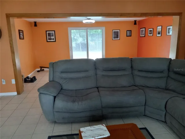 Living room opens to 10 x 17 family room with sliders