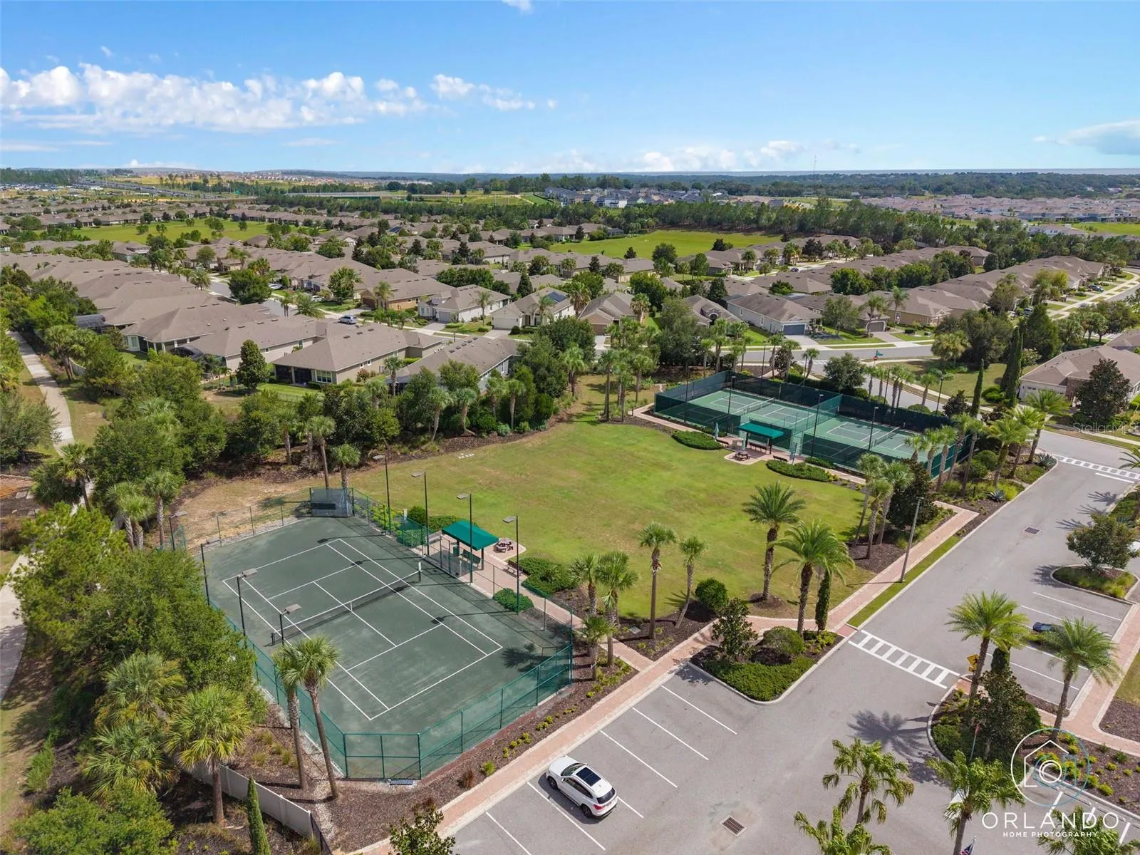 Clay Tennis Court. The Court is lighted for nighttime play.