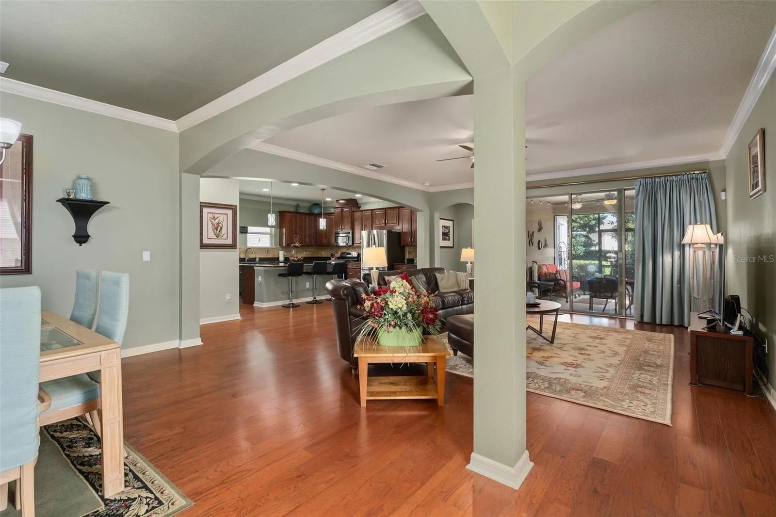 Entering to a spacious open floor plan with Engineered Hardwood, Crown Molding and a view of the Lanai