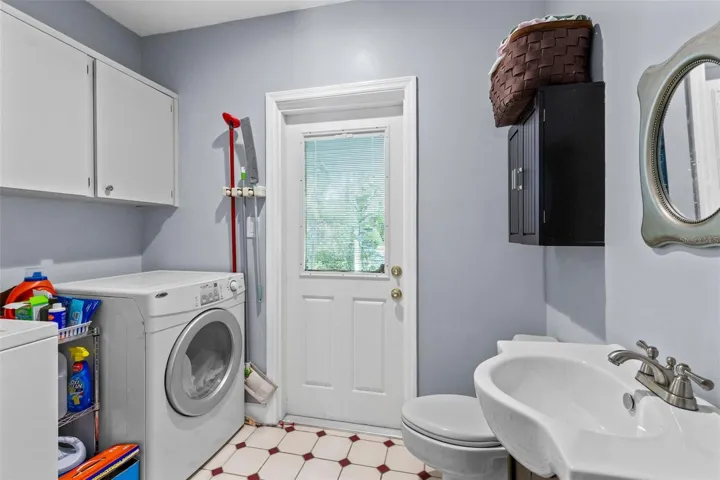 1/2 bath to pool access, laundry room