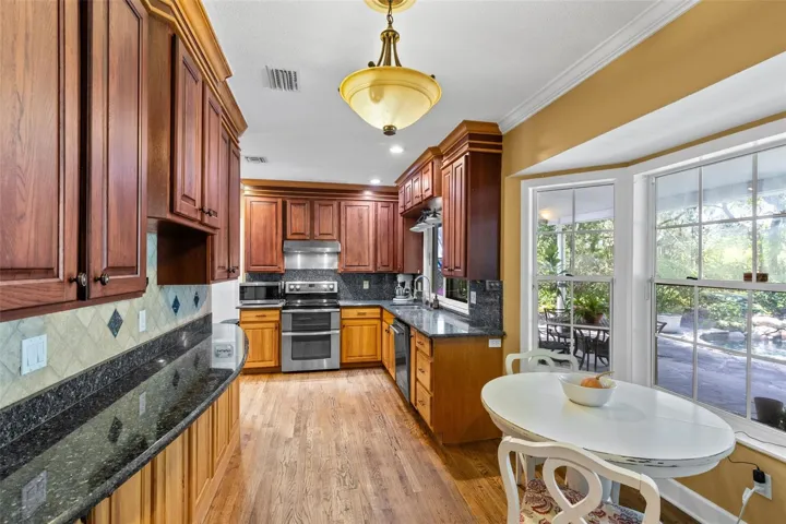 Rich wood cabinets and a perfect breakfast nook with a view!