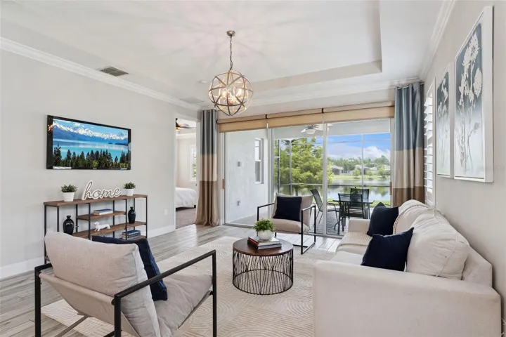 View of the Great Room w/ crown molding & a fantastic Pond view