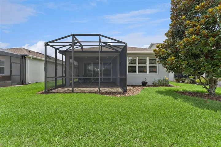 View of the Screen enclosed covered patio from the backyard