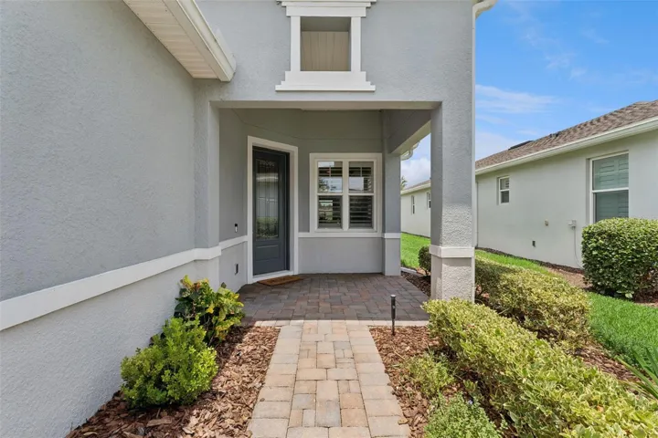 Front walkway & Porch w/ a leaded glass front door