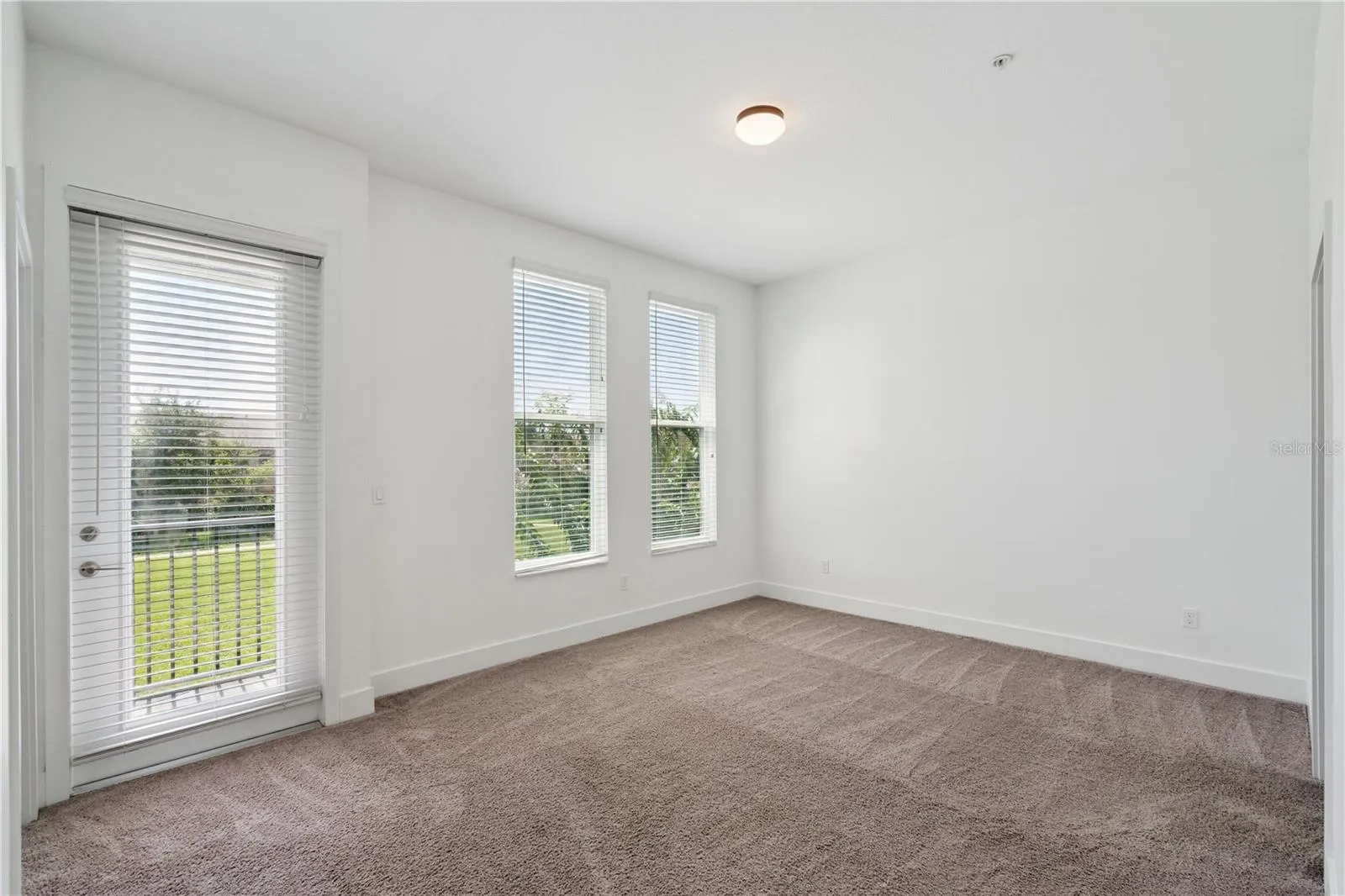 Primary bedroom with View and Balcony Door