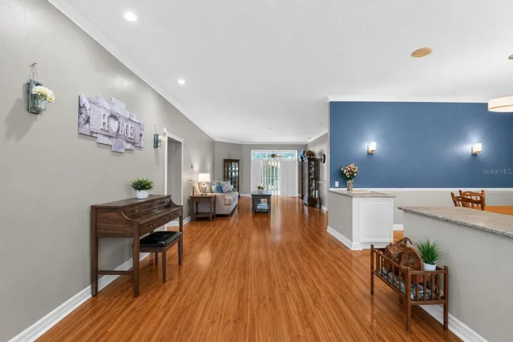 Front entry, living room, partial dining room view.