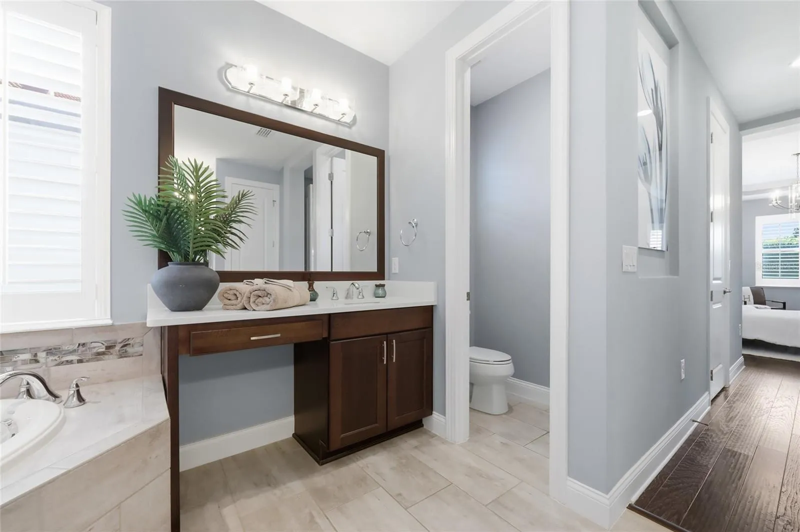 Her Vanity with Natural Light, Ample Counter Space &amp; Seating Nook