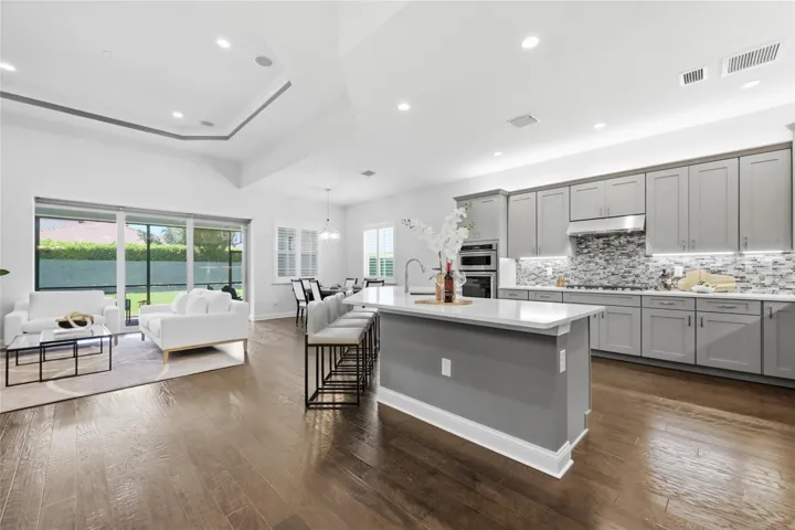 Chefs Kitchen with Quartz Counter tops, Upgraded Natural Gas Range, Upgraded Cabinets, and Oversized Island