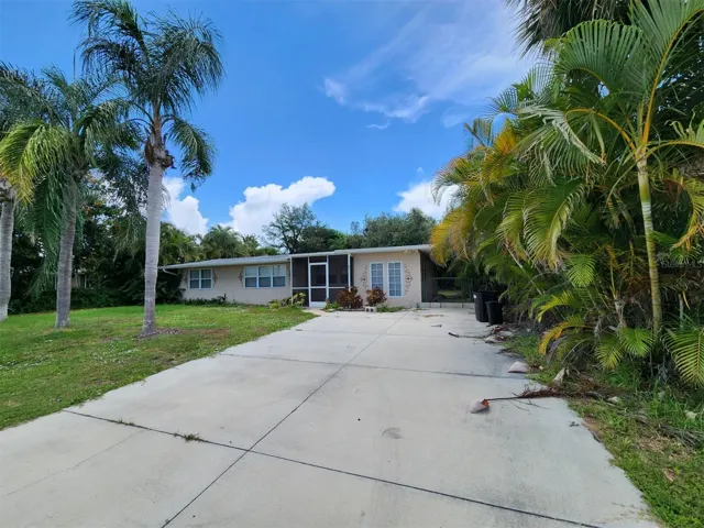 pwner extended the driveway. There is a gated entry to the backyard on the right of home.