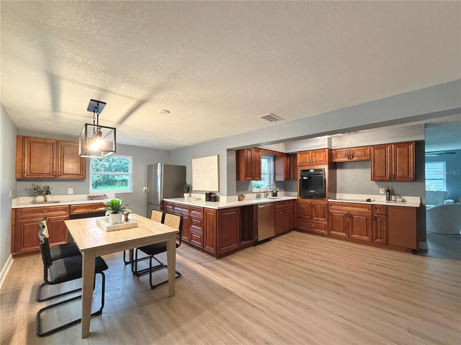 Quartz Countertops, Wood Cabinets, and Newer Appliances