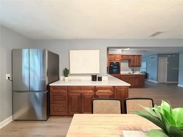 Quartz Countertops, Wood Cabinets, and Newer Appliances