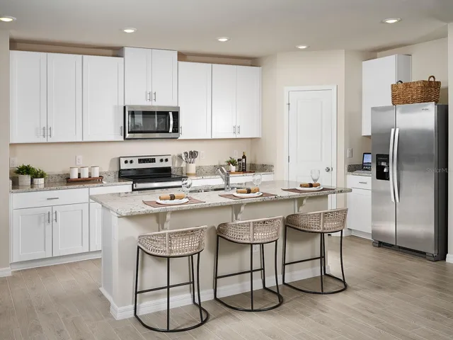 Photos are not of the actual home, but are photos of the builder home with same floorplan with similar interior finishes.
