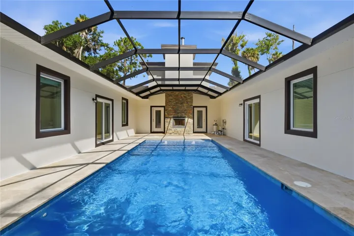 The pool showing the outside wood-burning fireplace