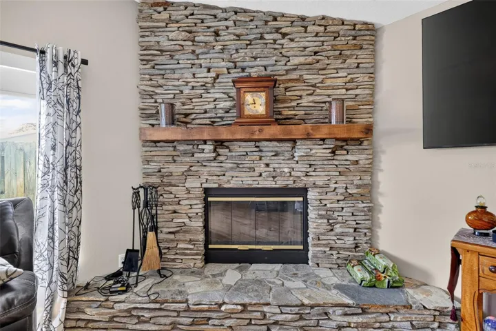 Wood burning stacked stone fireplace