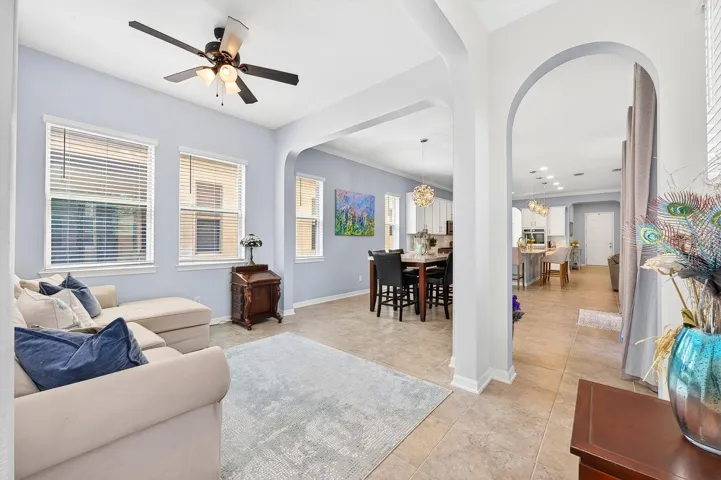 Elegant ARCHED DOORWAYS in the Dining Room lead to a spacious Family Room.