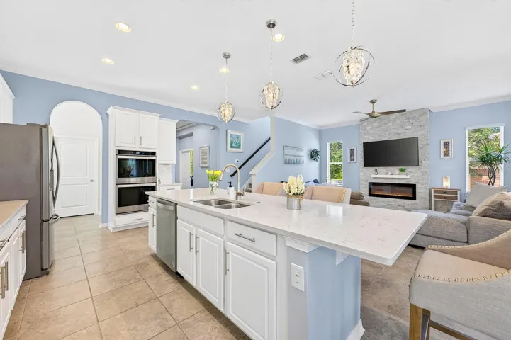 With room for counter height seating, the island serves as a comfortable spot for quick meals or gathering with guests.