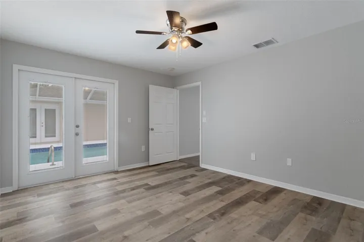 Primary Bedroom with entrance to Pool