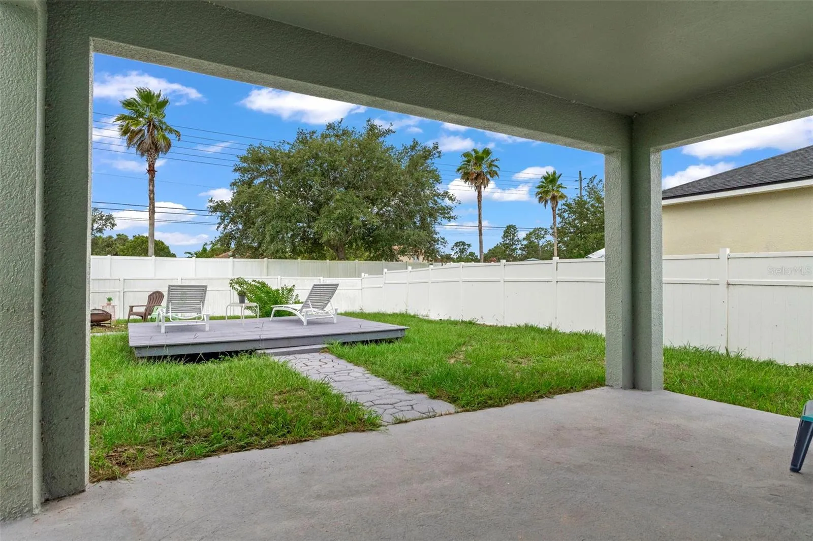 Rear Covered Porch Overlooking Fully Fenced Yard