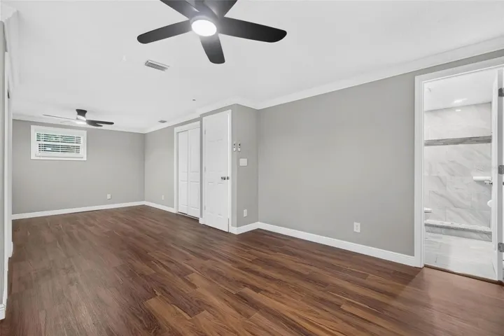 Primary bedroom leading to primary bed bath.