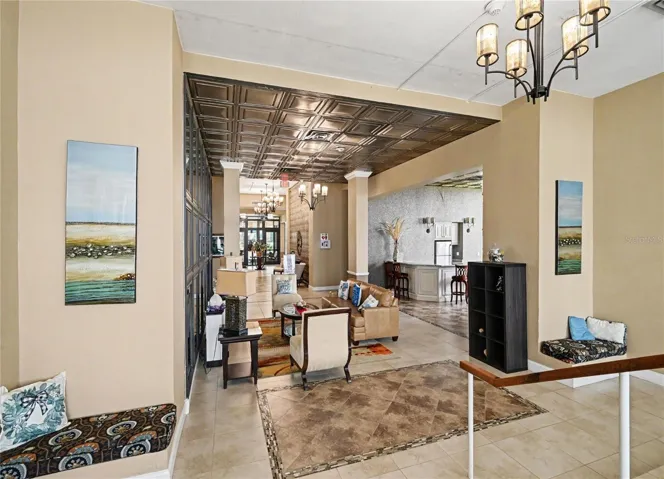 Lobby with kitchen area, library room, and bathrooms.