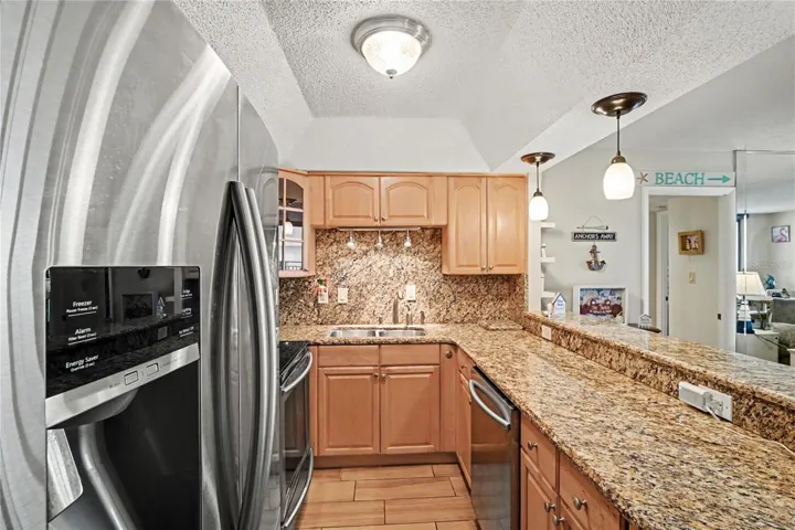 Kitchen has been remodeled opening it up to have full view of the living room and views.