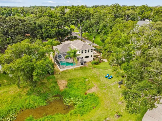 Your .44 acre Lot has mature trees and a peaceful vibe. The canal will fill up with a little more rain and return this amazing space to its true waterfront status.