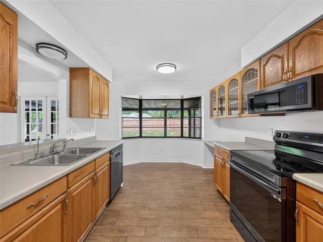 Kitchen Opens to the Breakfast Nook Looking into the Back Yard