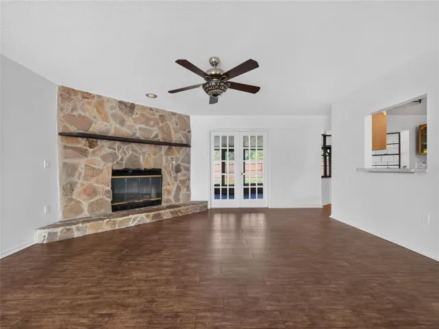 Great Room Features a Stone Fireplace