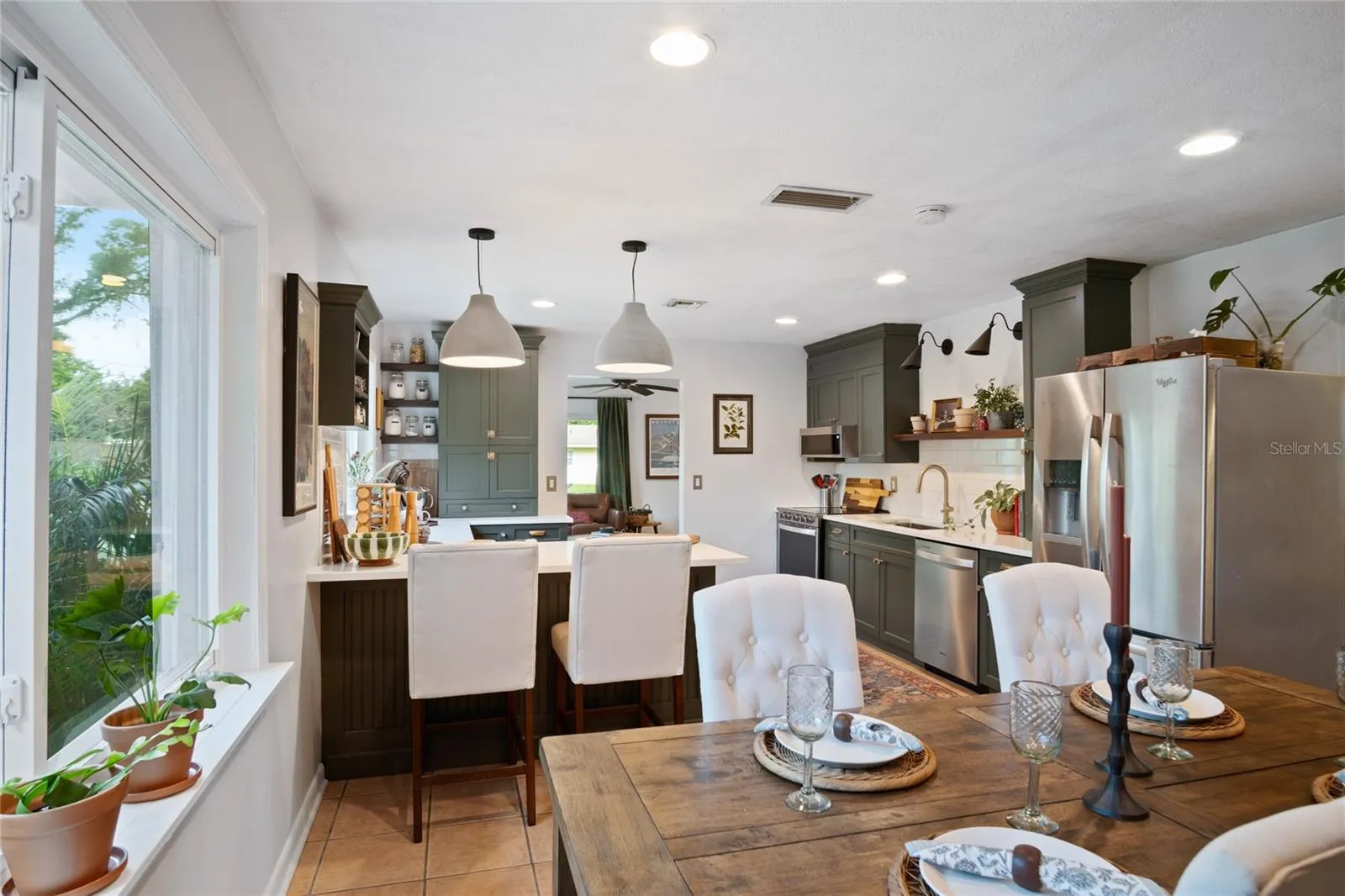 Spacious and well lit remodeled kitchen and dining room.