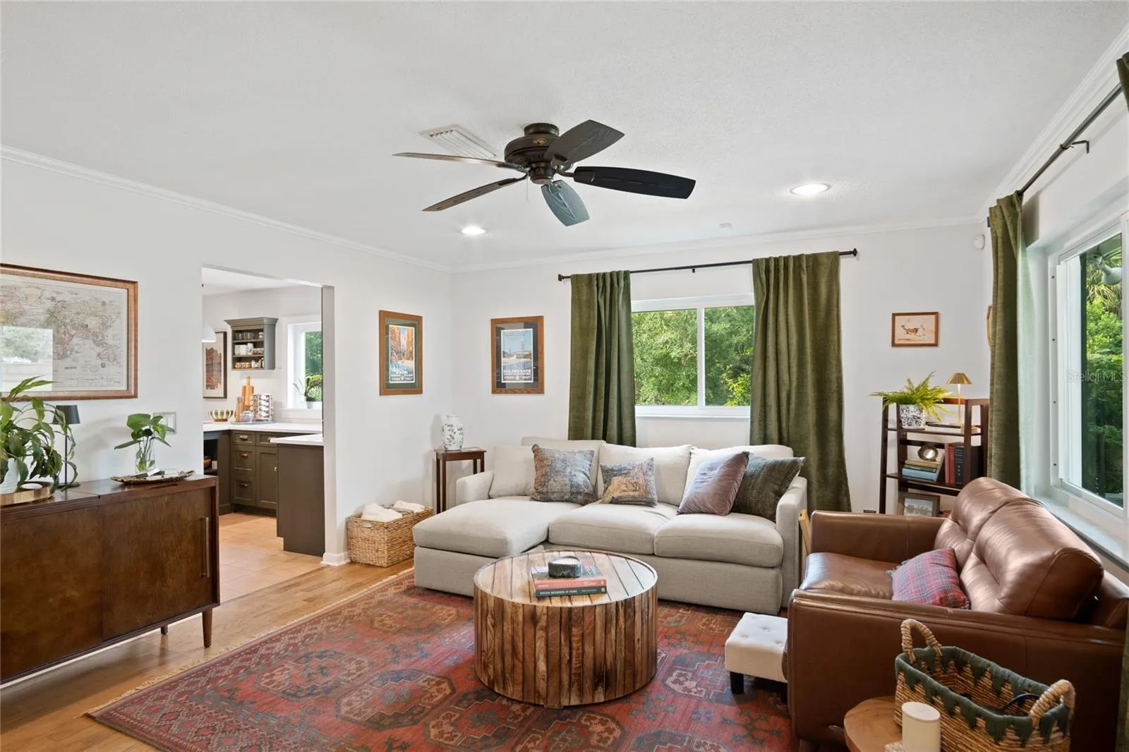 A charming living room with hard wood floors.