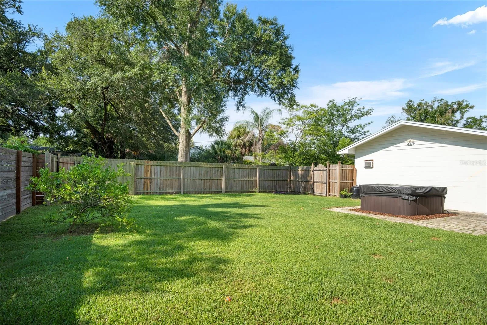 The back yard has plenty of room for fur babies running and playing, a playground for little ones, or a pool for everyone loving the Florida sunshine.