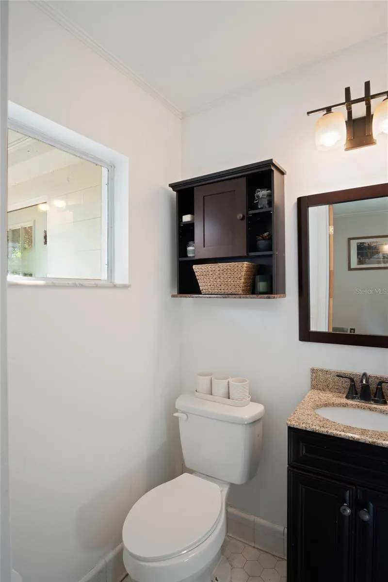 The half bath looks out to the back of the home.