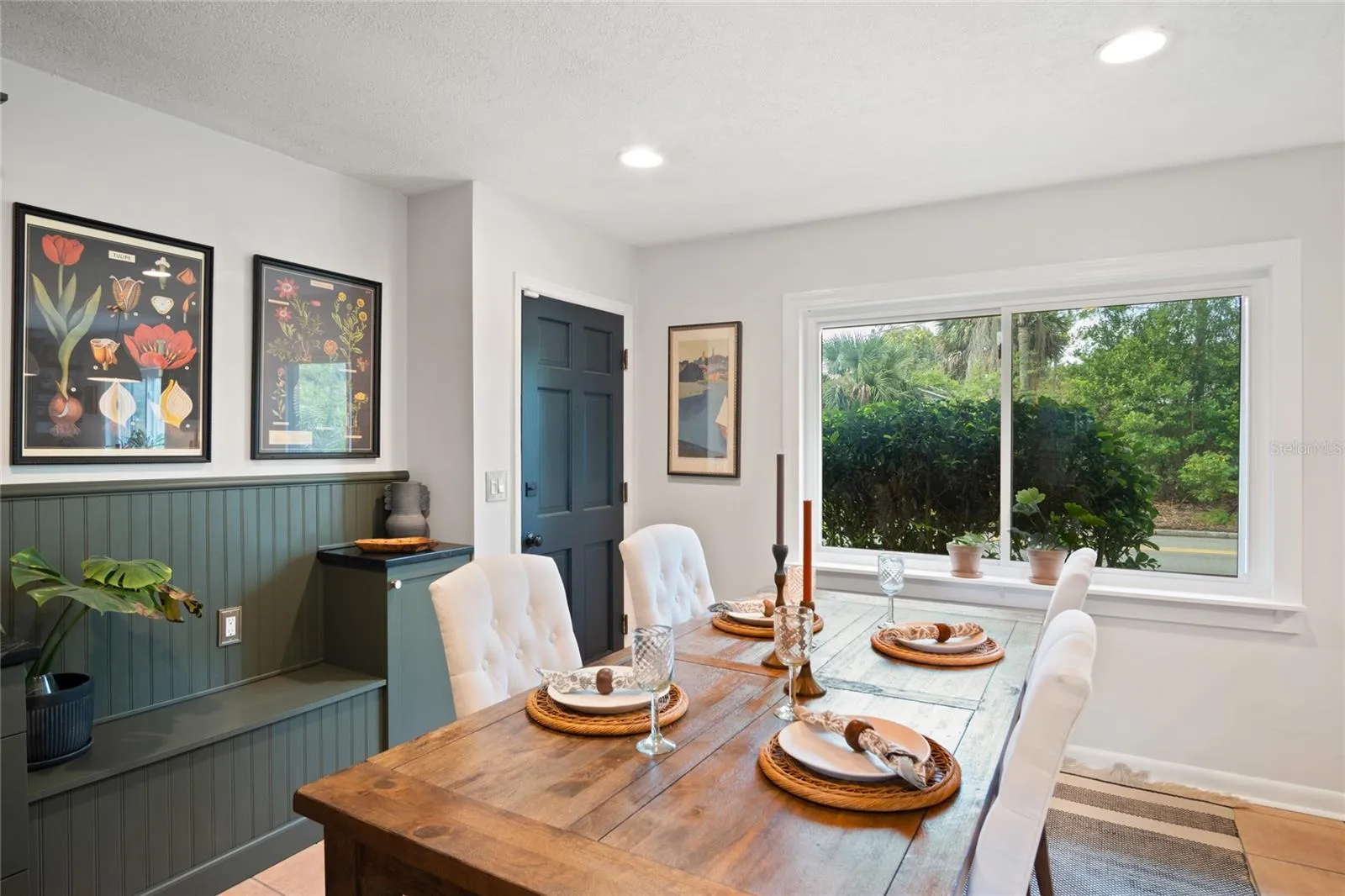 The remodeled dining area leading to the double car garage.