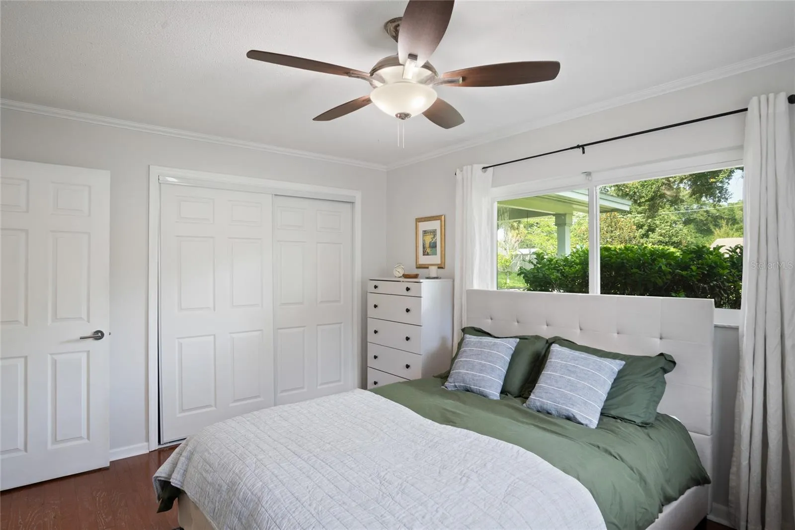 Another view of the primary bedroom with the closet.