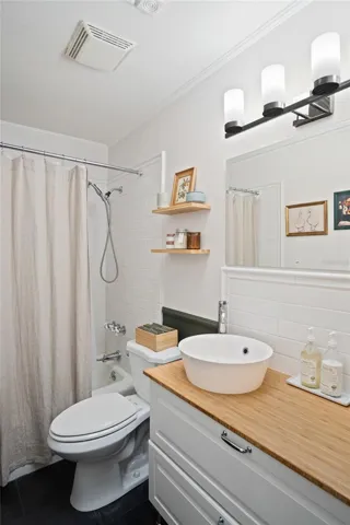The primary bathroom with a shower and tub.