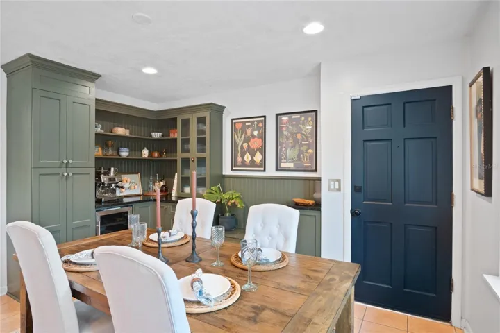 A view of the dining room and coffee bar with wine refrigerator.