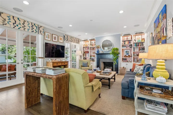 Sun filled family room opens to kitchen along the rear of the home.