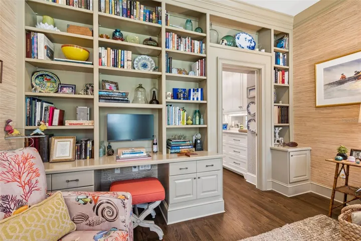 Built ins create an office area in the living room.