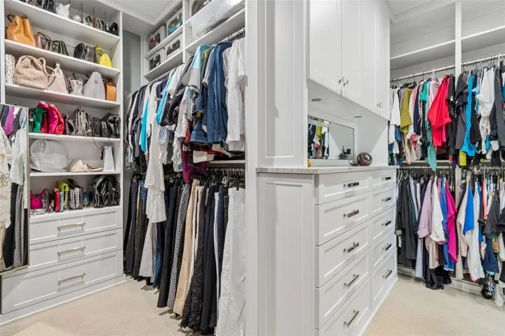 Her closet offers plenty of drawers and hanging space
