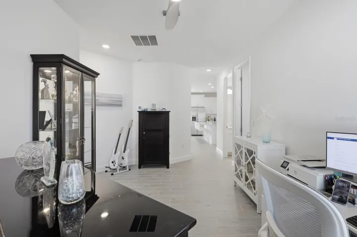 Looking out of the flex space towards the kitchen. How about a separate space for the kids to handout and play games or watch TV.