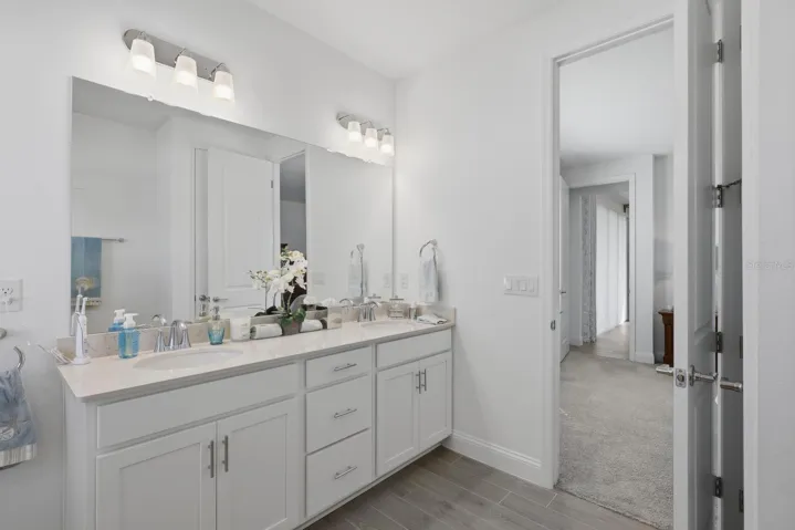 Double Sink Vanity with drawers for storage in the primary bathroom.