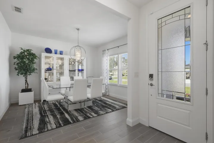 The gorgeous privacy glass front door greets you and allow so much light into the space.