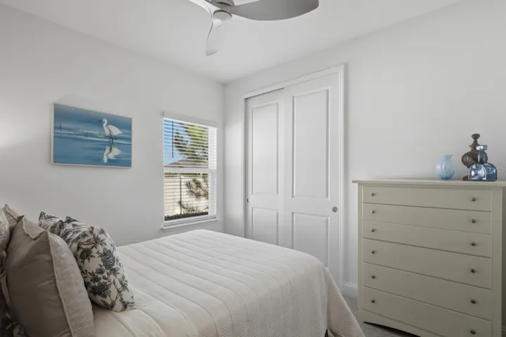 Another angle of the second bedroom. All bedrooms have ceiling fans.