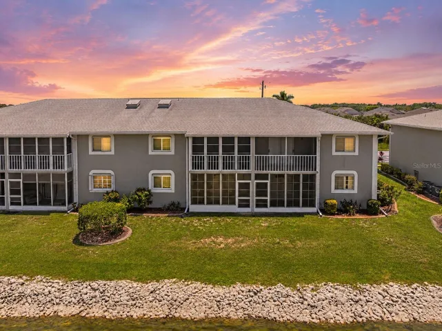 RearExterior_3310LovelandBlvd_PuntaGorda_ScreenedLanai_Twilight.jpg