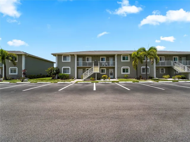 FrontExterior_3310LovelandBlvd_PuntaGorda_CommunityCourtyard_Daylight.jpg