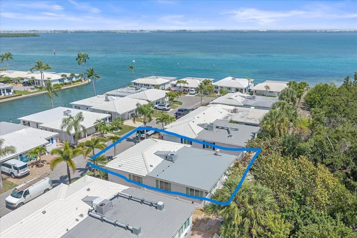 Location steps from the Bay and across Street from Marina